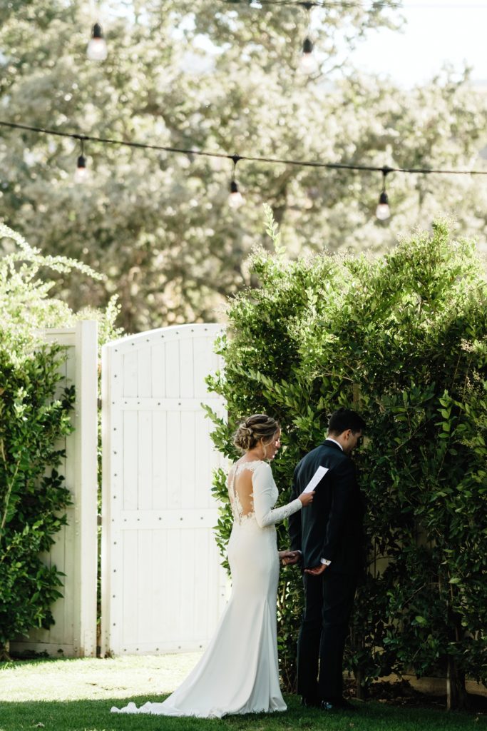 A Classic Vineyard Wedding at Triunfo Creek Vineyards, bride and groom secret look 