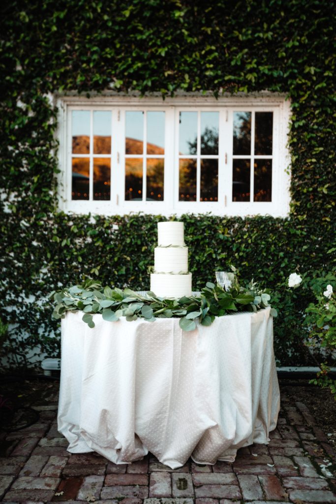 A Classic Vineyard Wedding reception at Triunfo Creek Vineyards, green and white wedding cake