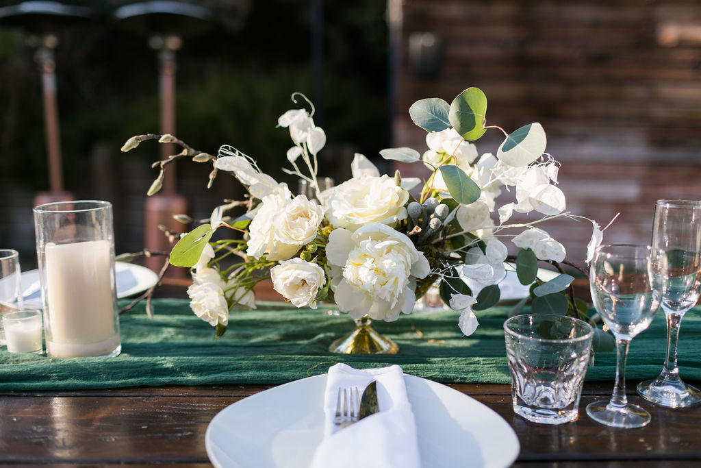 A Romantic Forest Inspired Wedding outdoor reception at the 1909, white and green floral centerpiece
