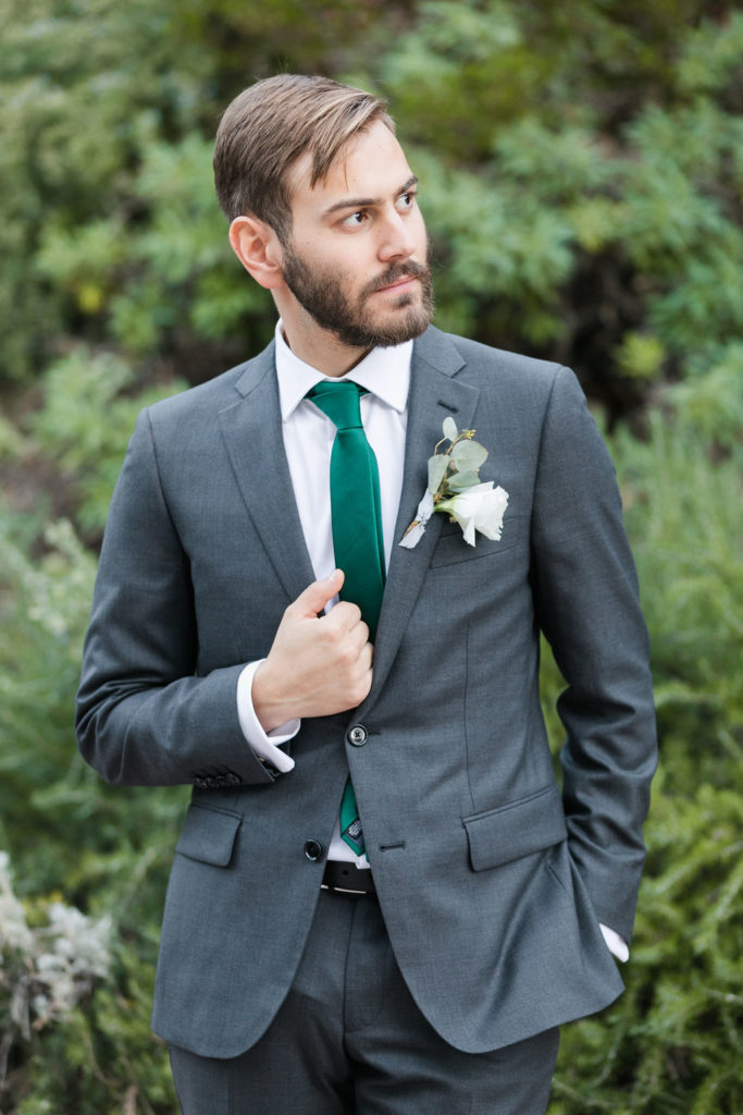 A Romantic Forest Inspired Wedding at the 1909, groom in dark grey suit and green tie