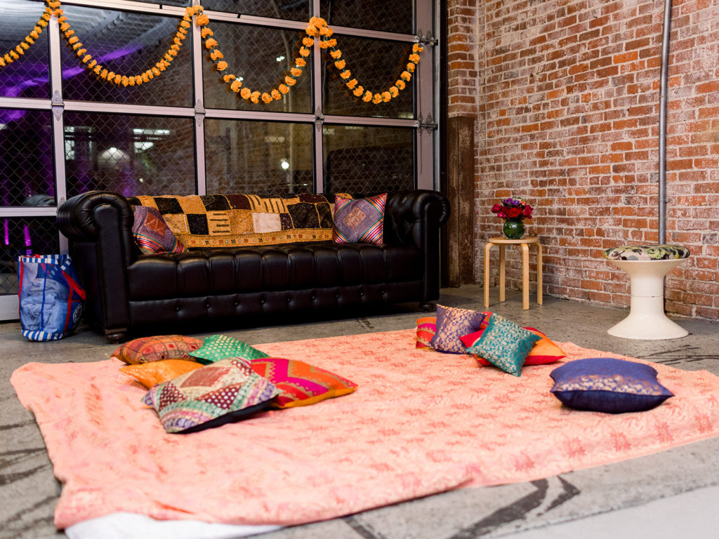 A lively sangeet celebration at The Unique Space in DTLA, bright and colorful mehndi area