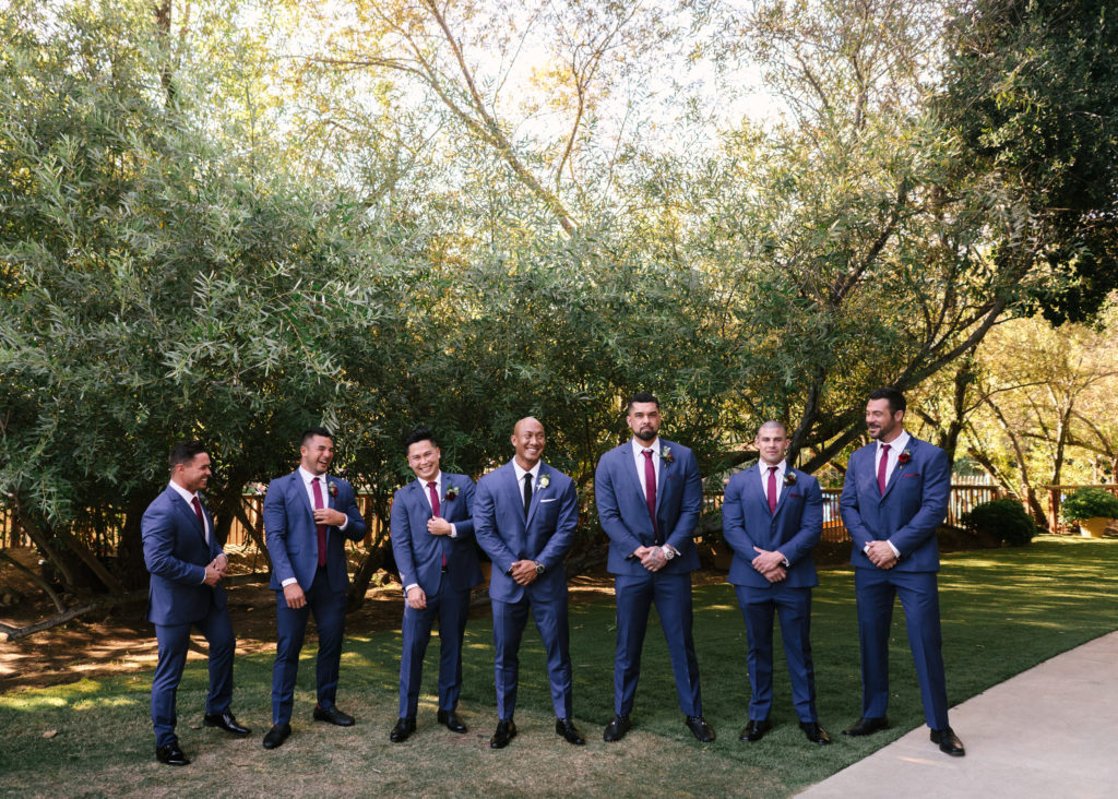 A Fall Wedding at Calamigos Ranch, bride and groom with wedding party, groomsmen in dark blue suits