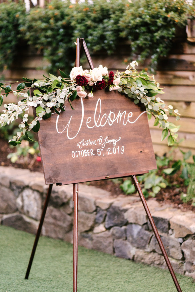 A Fall Wedding ceremony at Calamigos Ranch, wooden welcome sign