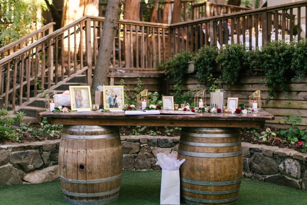 A Fall Wedding ceremony at Calamigos Ranch, welcome table with gold frames