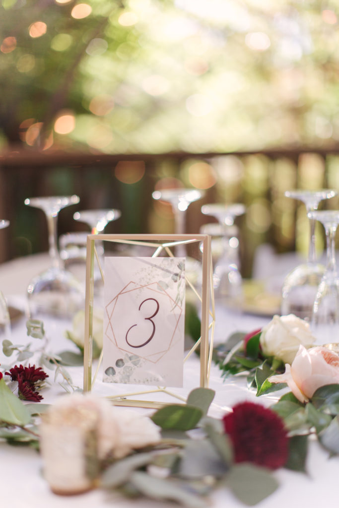 A Fall Wedding reception at Calamigos Ranch, gold table number frame