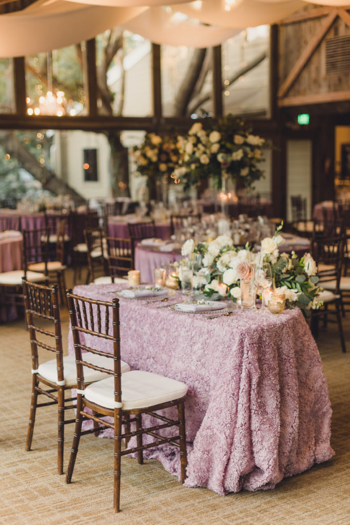 A Springtime Malibu Wedding reception at Calamigos Ranch, Redwood Room sweetheart table with lilac details