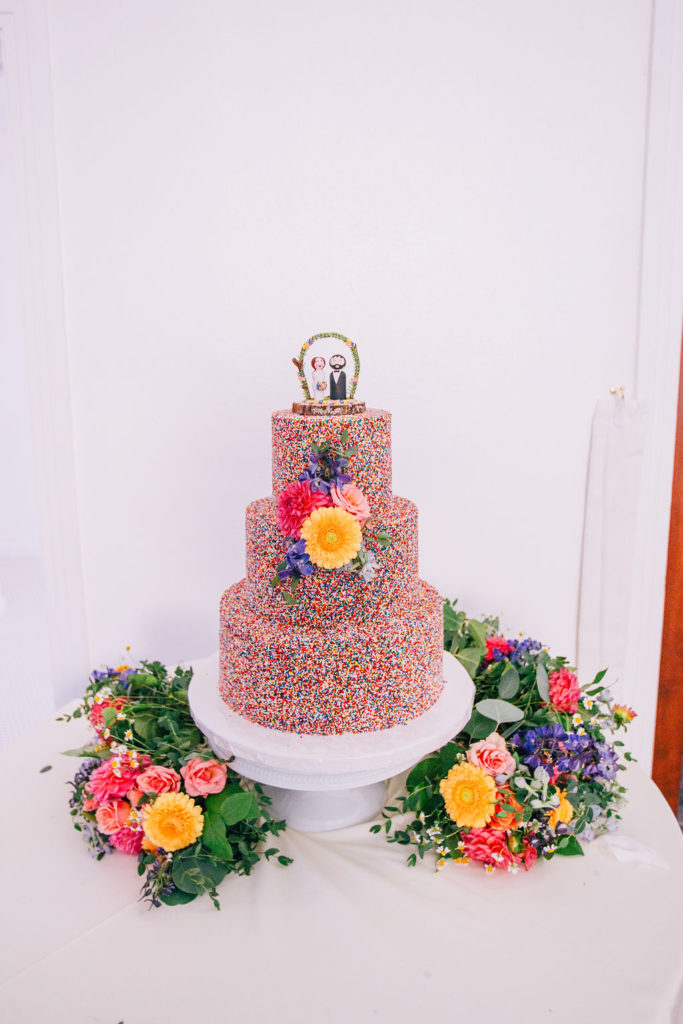 colorful sprinkle covered wedding cake