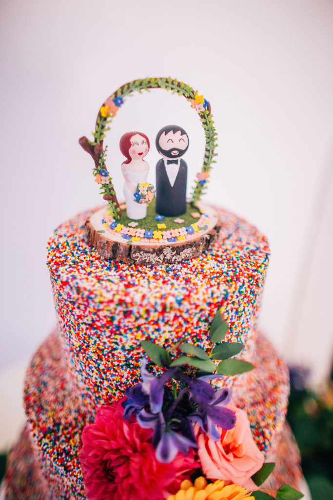 colorful sprinkle covered wedding cake