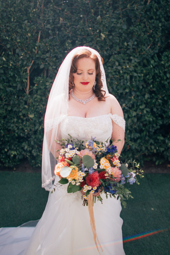 bride with colorful wedding bouquet at York Manor