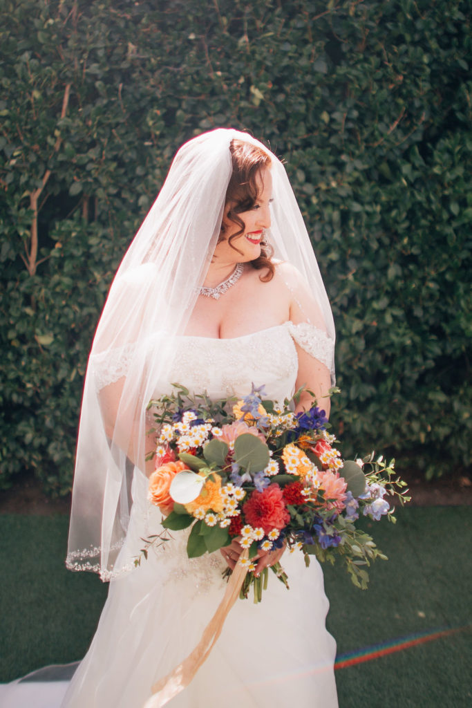 bride with colorful wedding bouquet at York Manor
