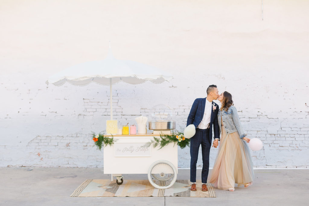 cotton candy inspired styled shoot, bride and groom with cotton candy