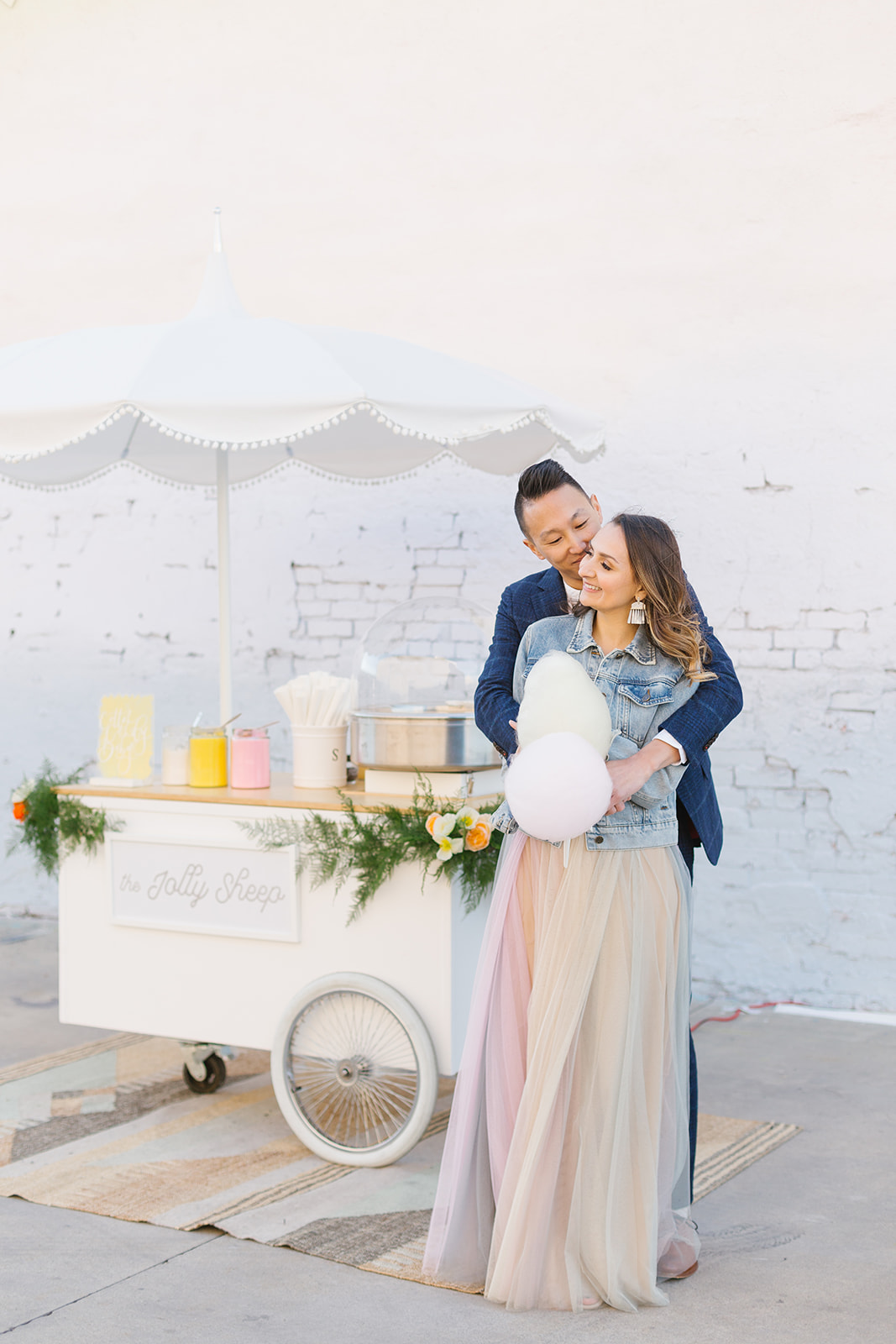 cotton candy inspired styled shoot, bride and groom with cotton candy