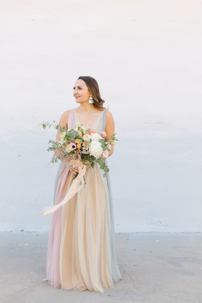 cotton candy inspired styled shoot, bride with pastel colored wedding dress