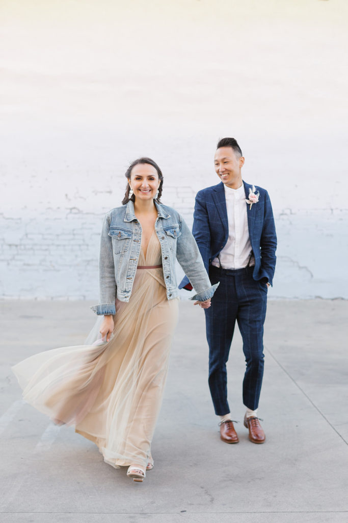 bride in colorful wedding dress and jean jacket