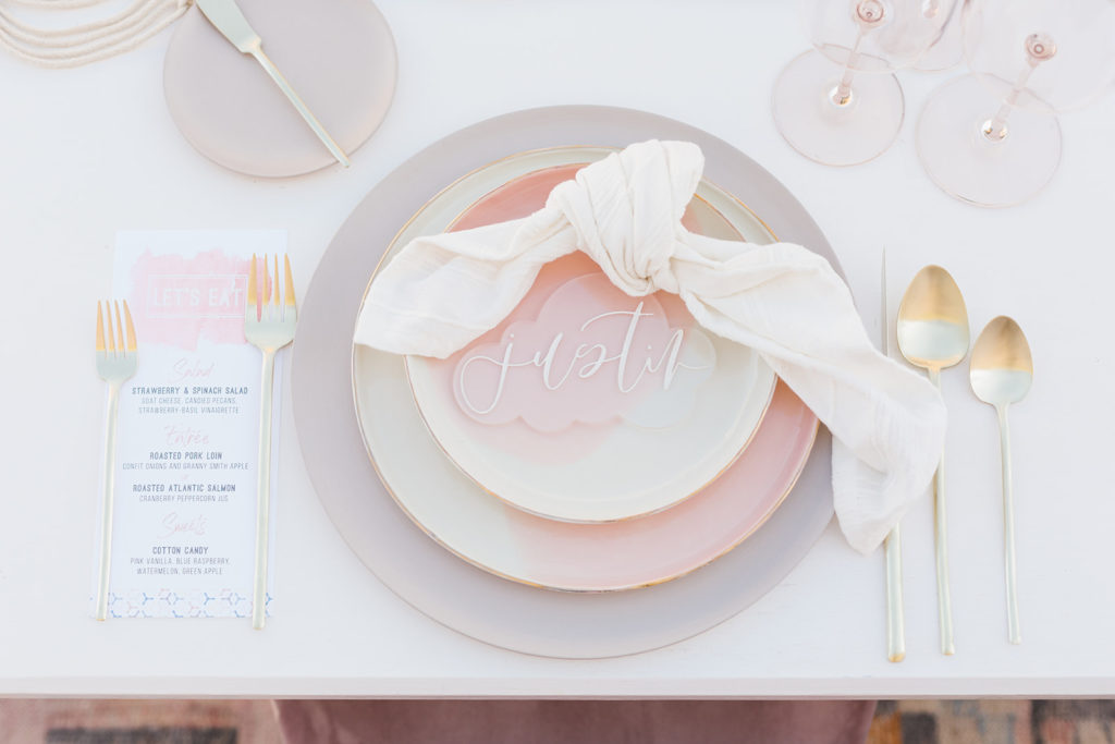 cotton candy inspired styled shoot, wedding reception table set up with clear guest placards and soft pink elements