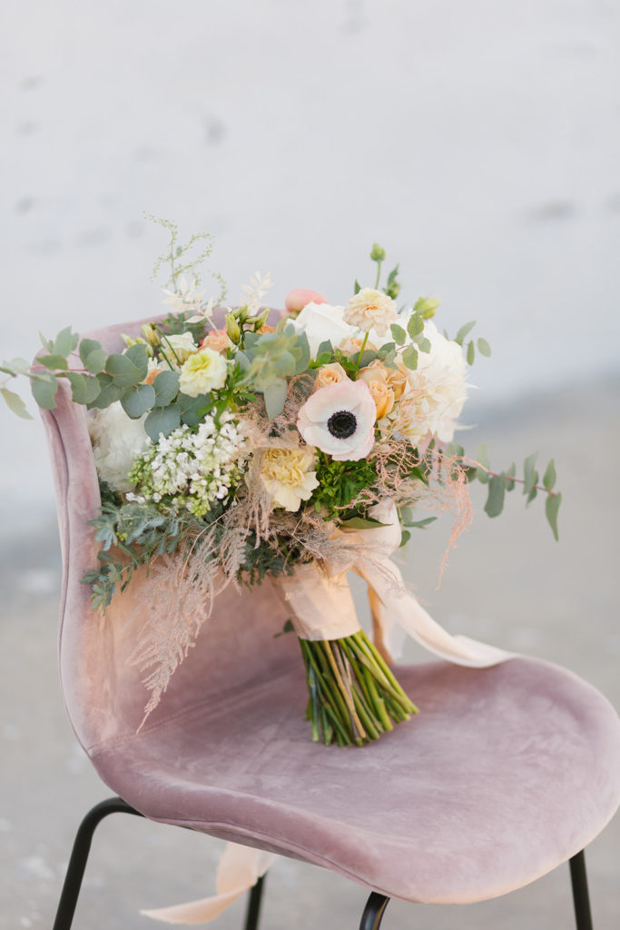 dusty rose bridal bouquet with orange and white flowers
