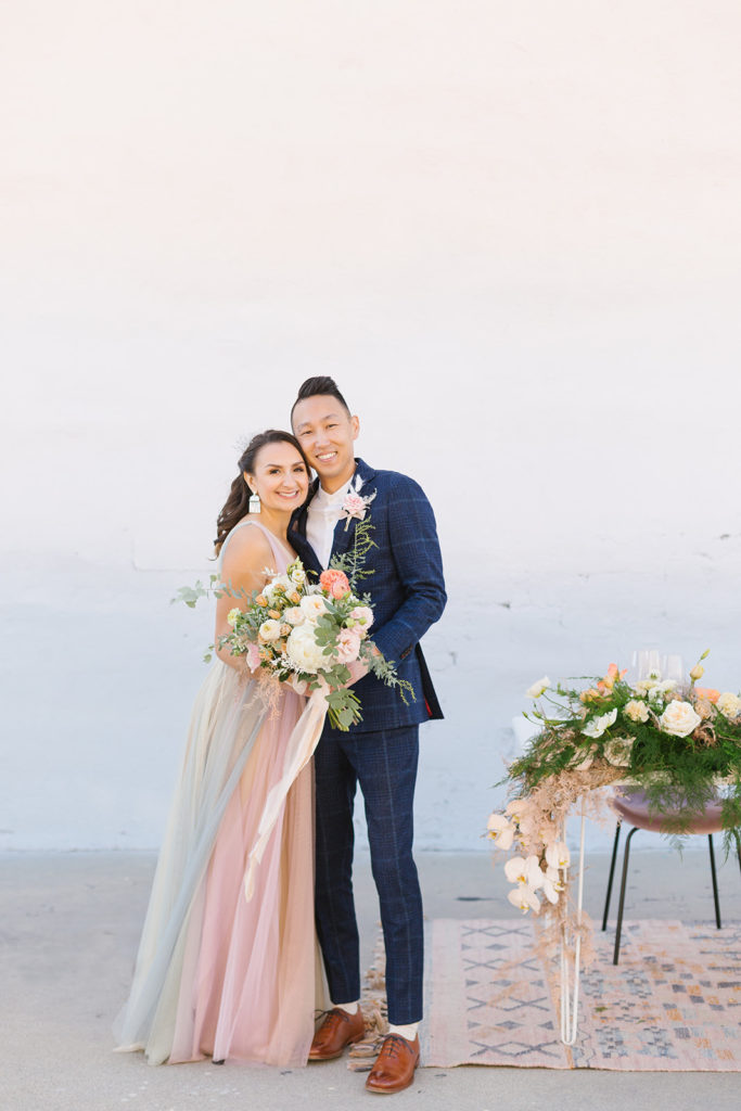 cotton candy themed wedding reception with sunset earth tones, bride and groom portrait shot