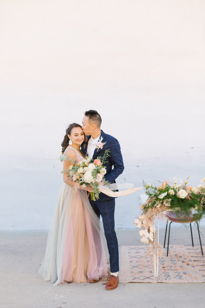 cotton candy themed wedding reception with sunset earth tones, bride and groom 