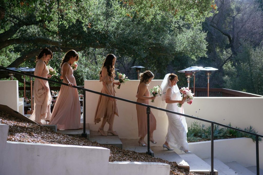 bride with bridesmaids in pink dresses