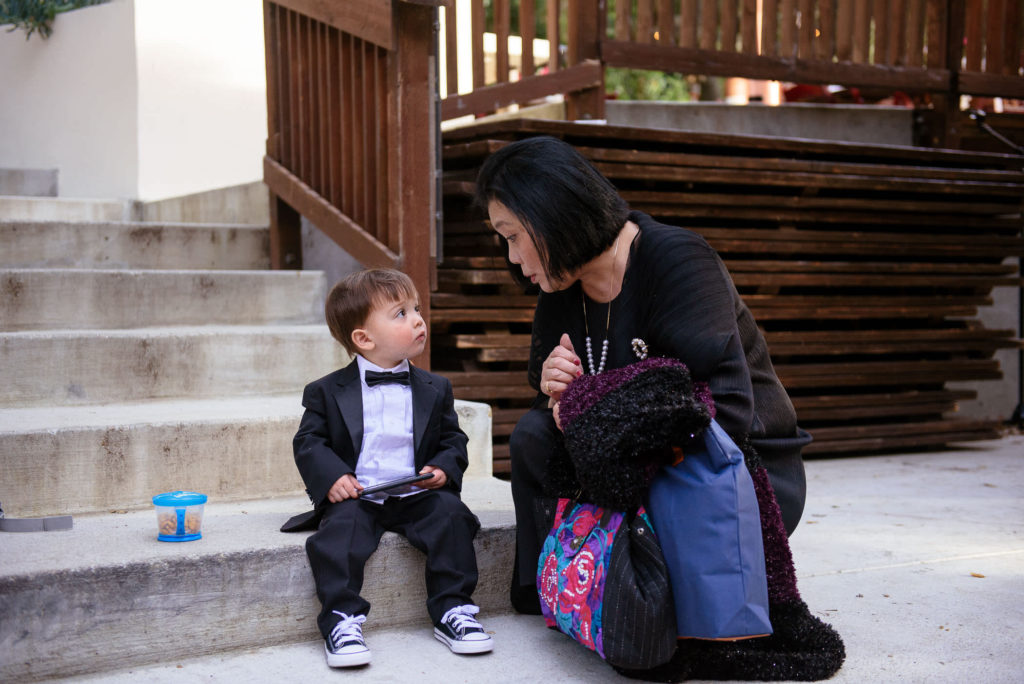 ring bearer in black suit and bowtie