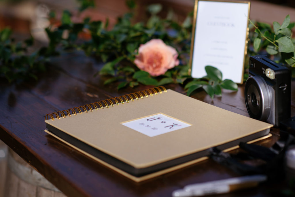 micro wedding at the 1909, wedding welcome table with polaroid guest book