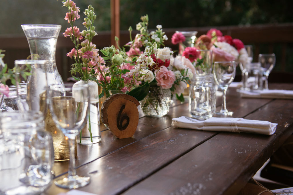 micro wedding reception table with wooden table number at the 1909