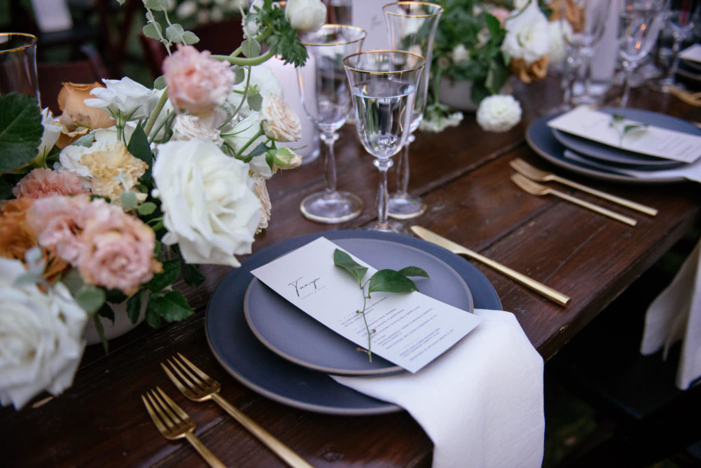 Sophisticated wedding reception at the 1909, matte black tableware with pink and gold accents
