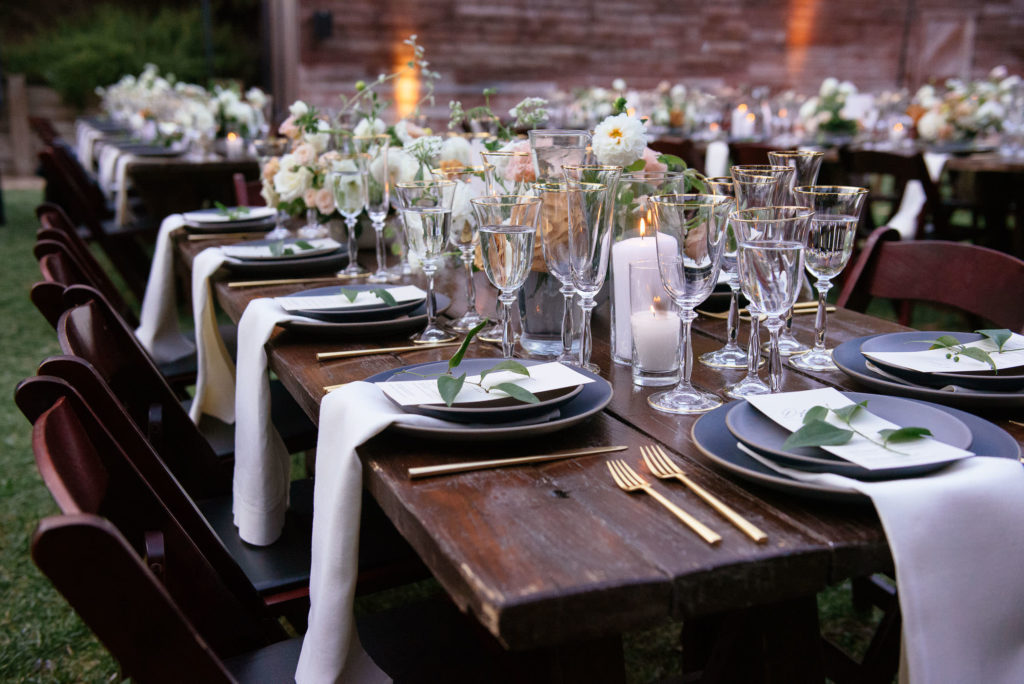 Sophisticated wedding reception at the 1909, matte black tableware with pink and gold accents