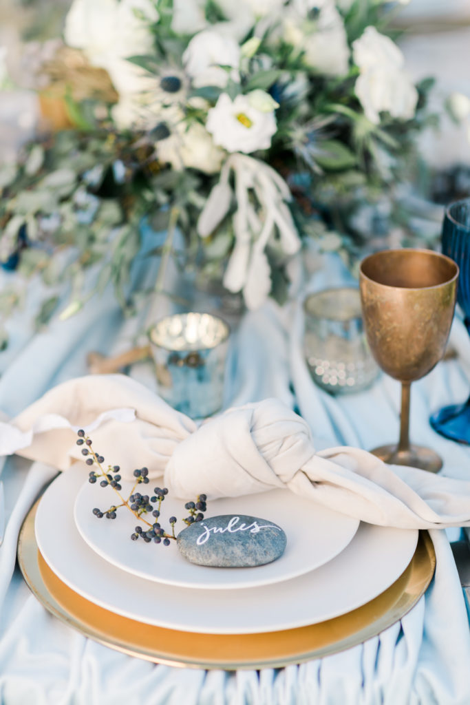 river rock place card with white calligraphy