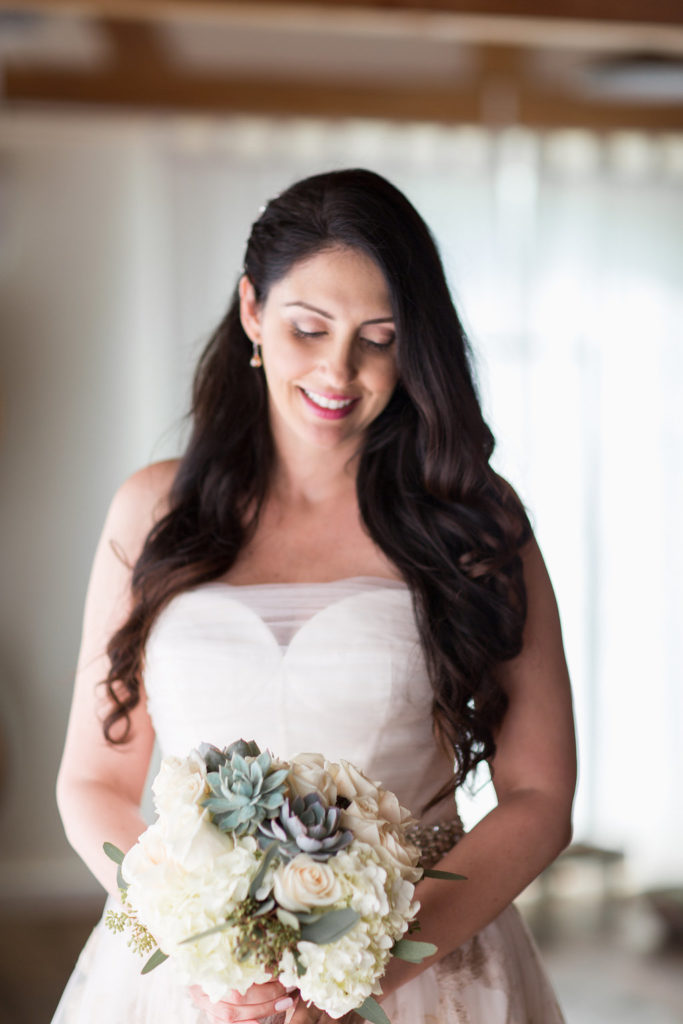 bridal portrait shot in strapless wedding dress with brocade details and succulent bridal bouquet