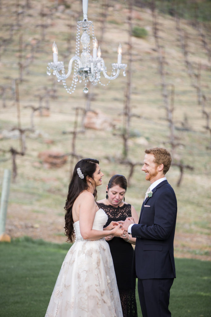 A sweet, small wedding ceremony at Triunfo Creek Vineyards with chandelier overheard