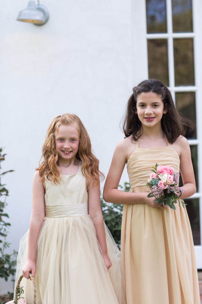 flower girls in pale yellow dresses