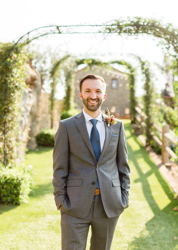 groom portrait shot with grey suit and blue tie