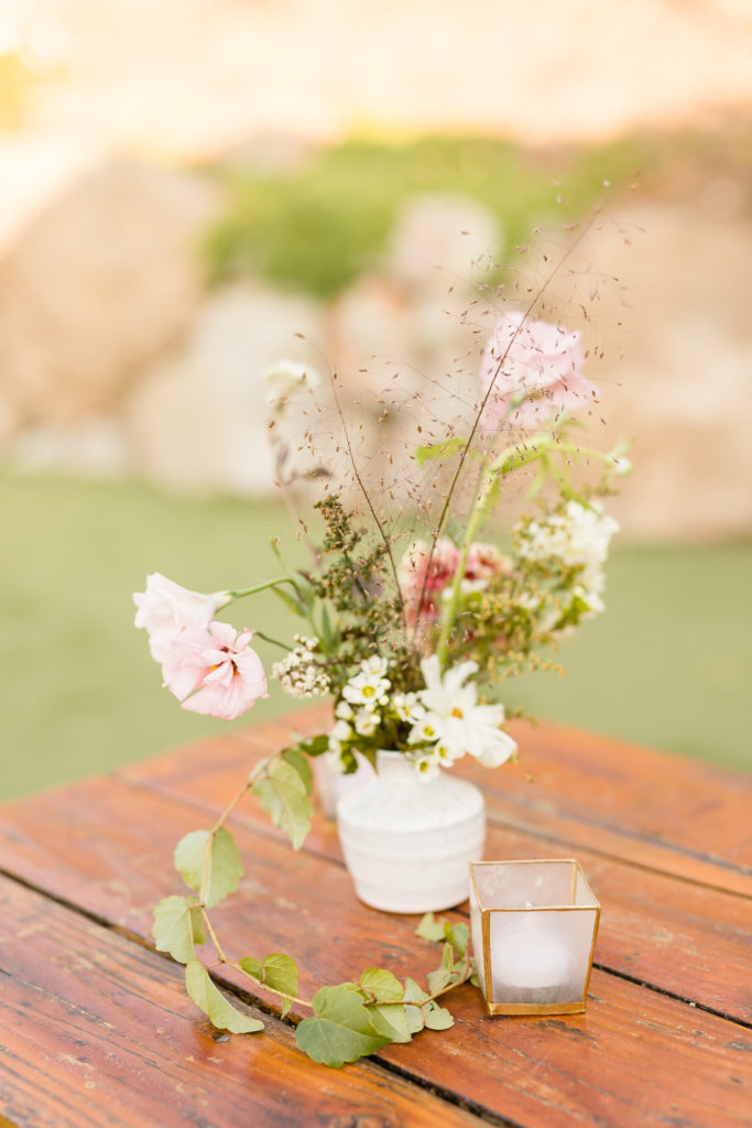 cocktail hour at Cielo farms with small flower arrangements 