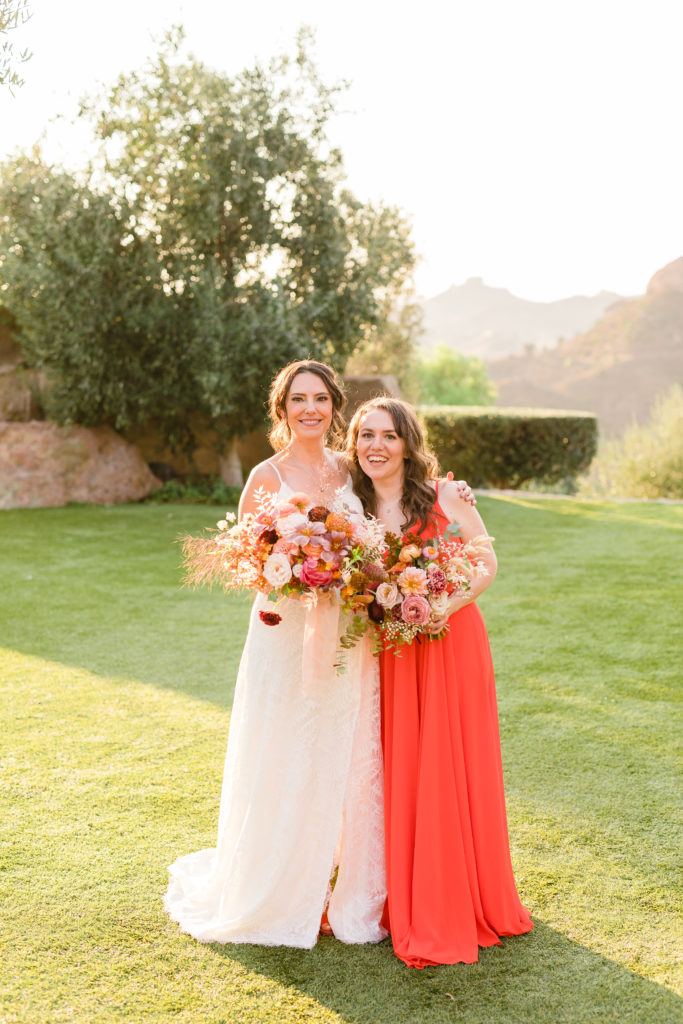 bride with bridesmaid in red dress