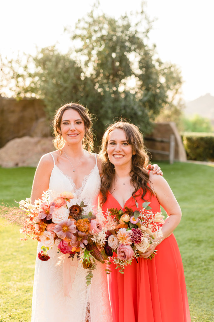 bride with bridesmaid in red dress