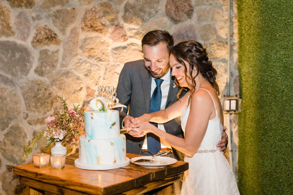 bride and groom cutting cake at Cielo Farms wedding