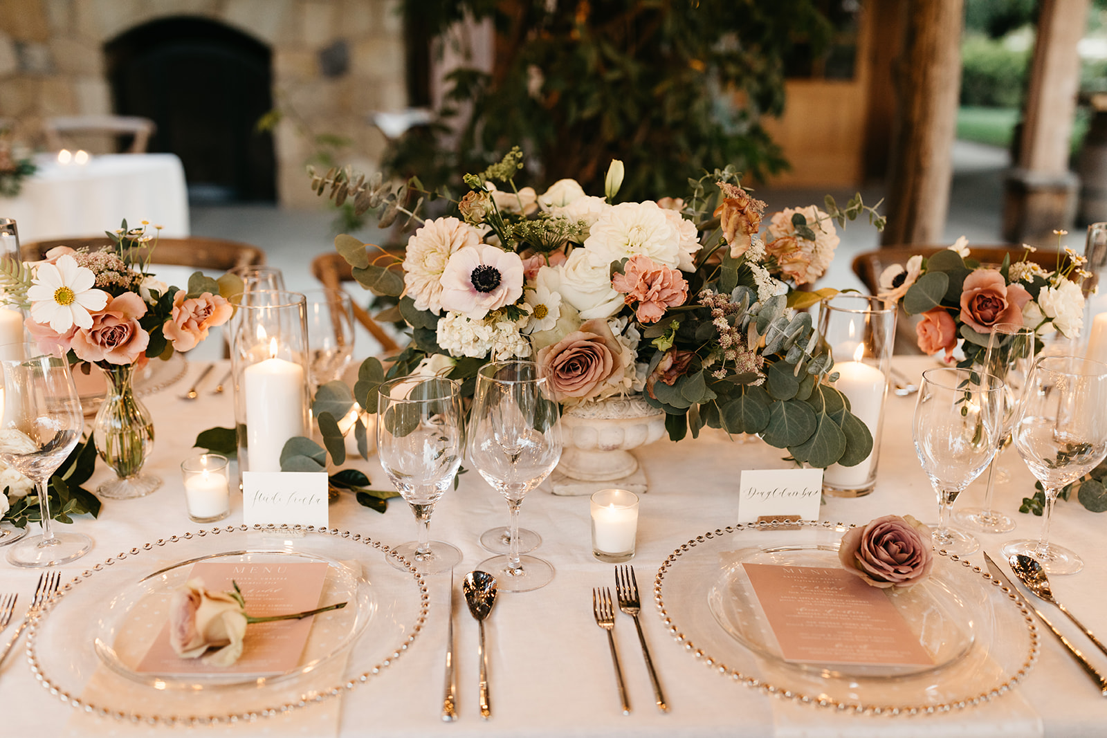 Intimate vineyard wedding reception at Roblar winery under market lights with blush pink and greenery