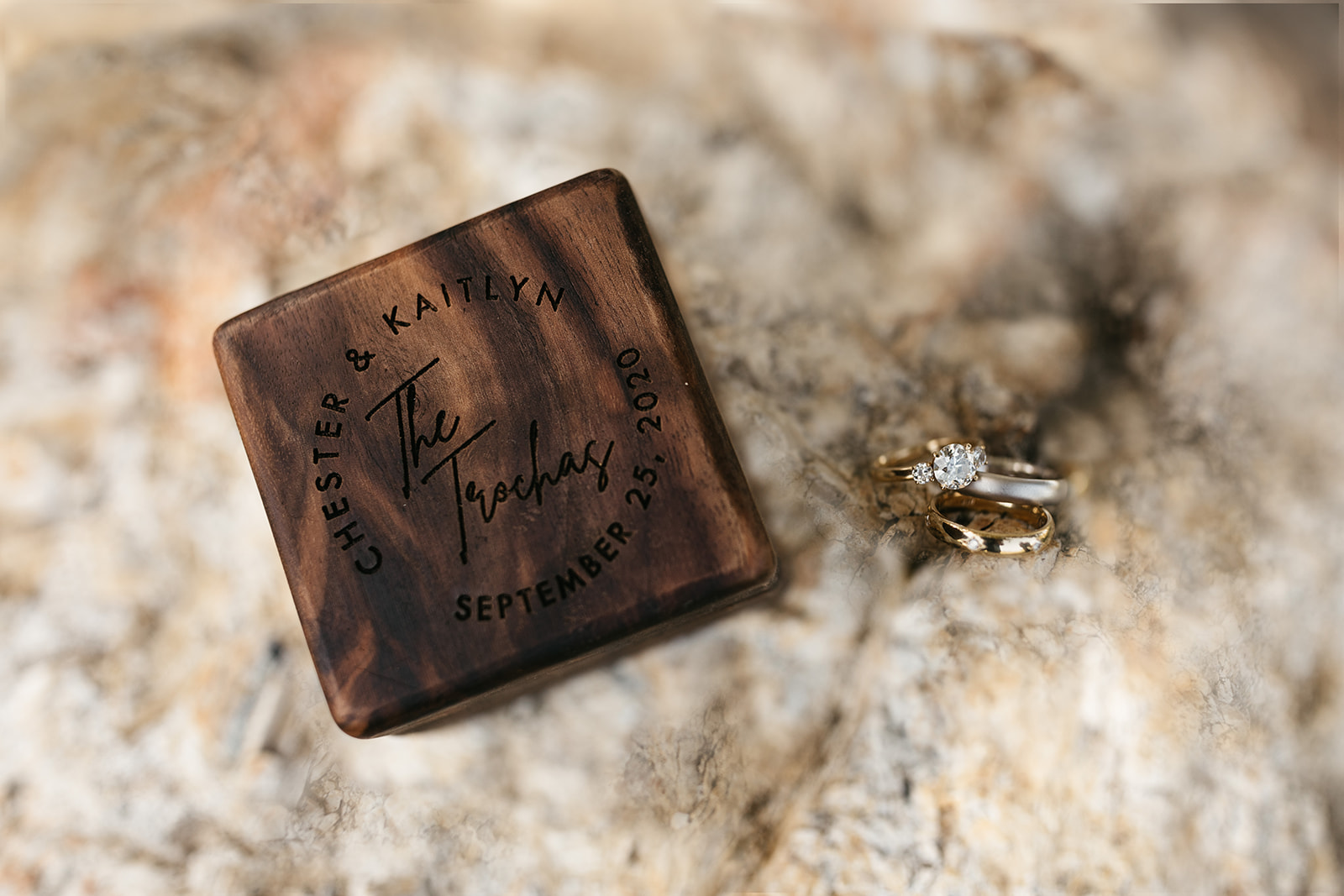 ring detail shot with wooden ring box inscribed with couples wedding date