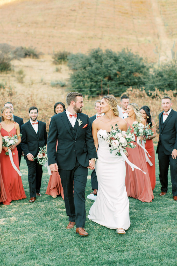 autumn wedding party dresses and suits, portrait shot in vineyard