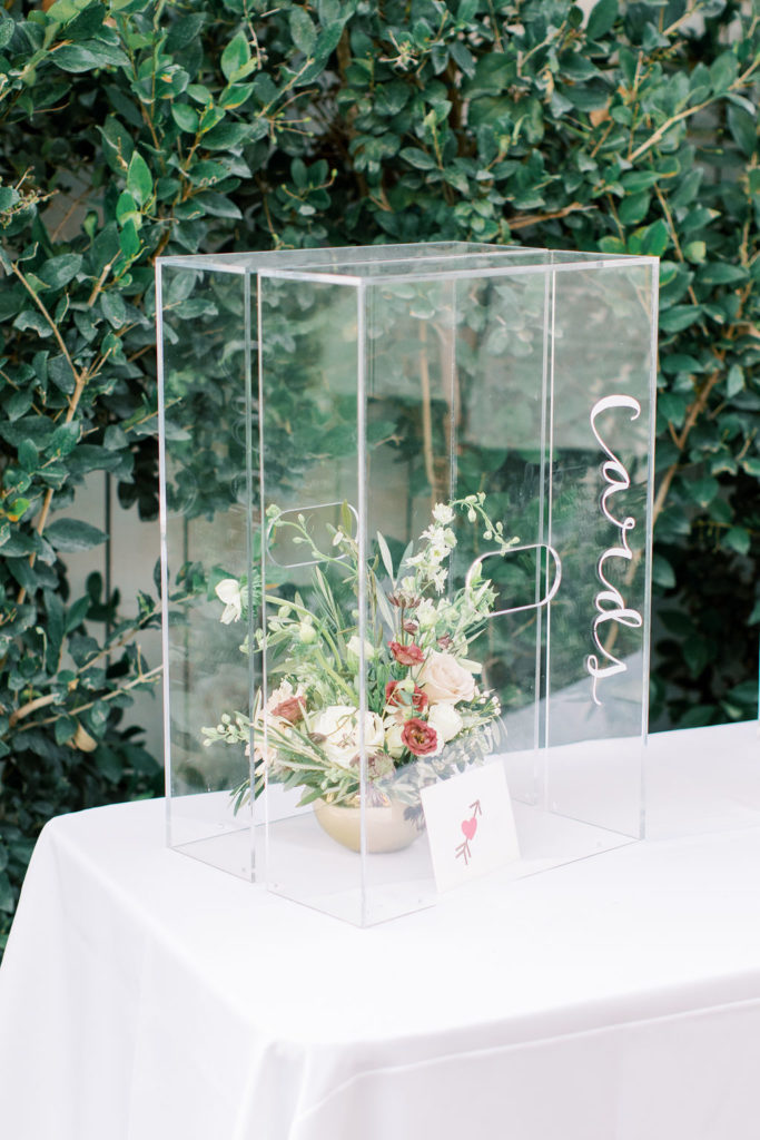 clear acrylic card box with floral arrangement inside