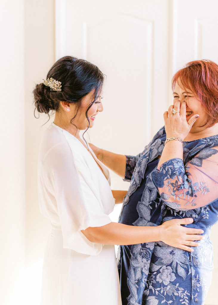 bride getting ready for backyard ceremony at home