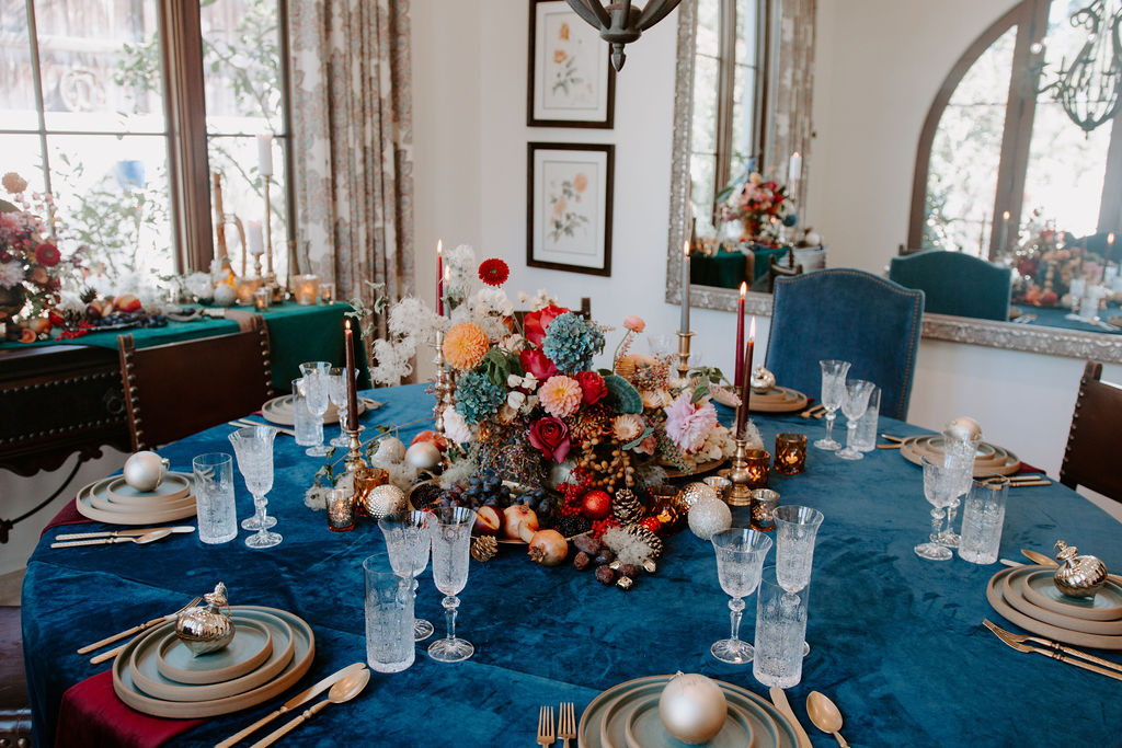 non-traditional holiday decorations with deep blue, red and gold colors