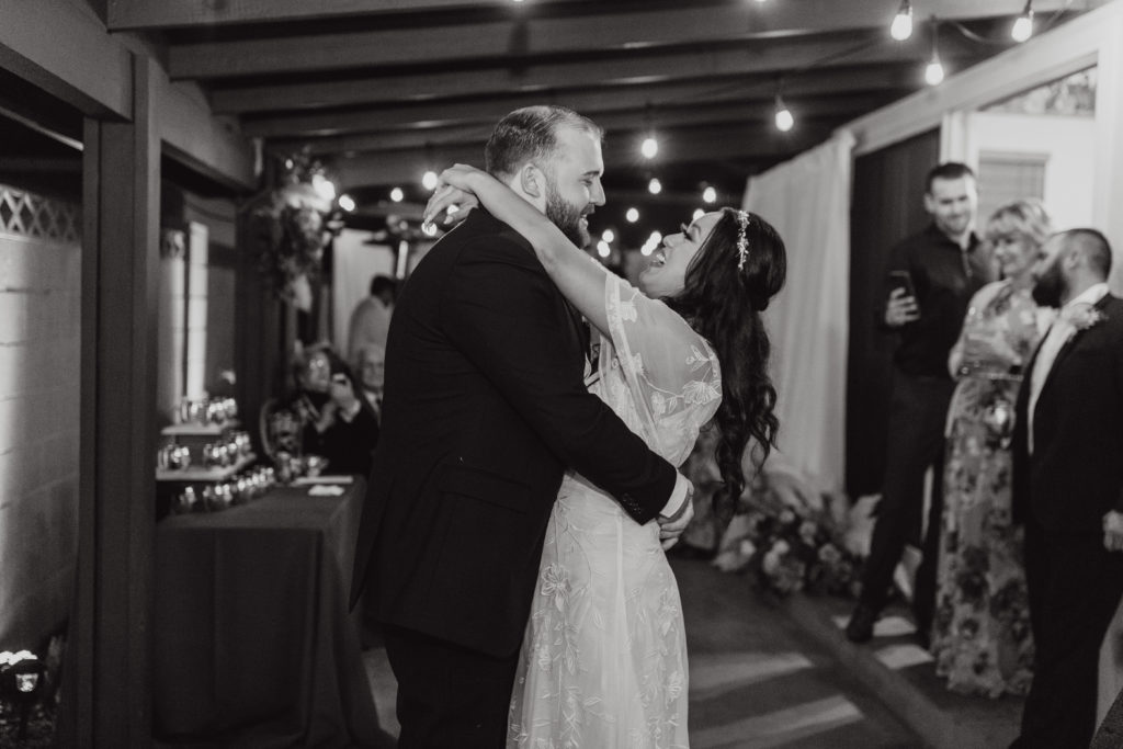 bride and groom share first dance in their backyard wedding reception