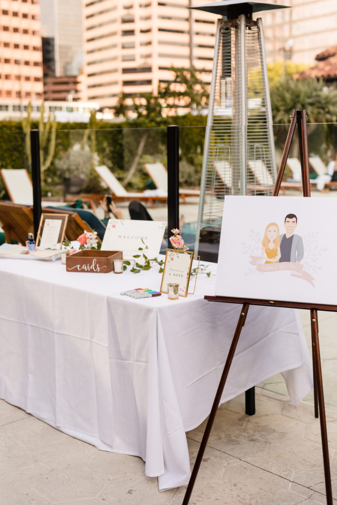 wedding welcome table with customized couple caricature portrait  