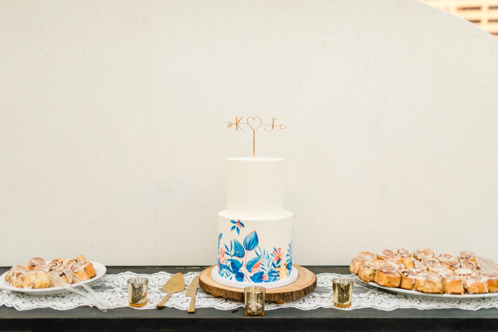 two tier wedding cake inspired by the Hotel Figueroa mural