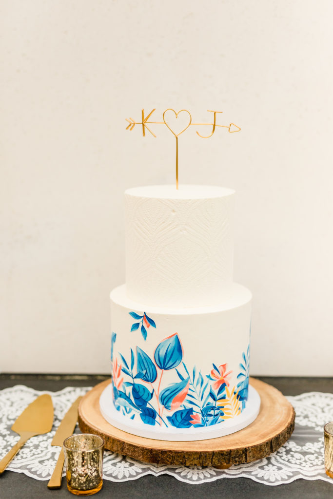 two tier wedding cake inspired by the Hotel Figueroa mural