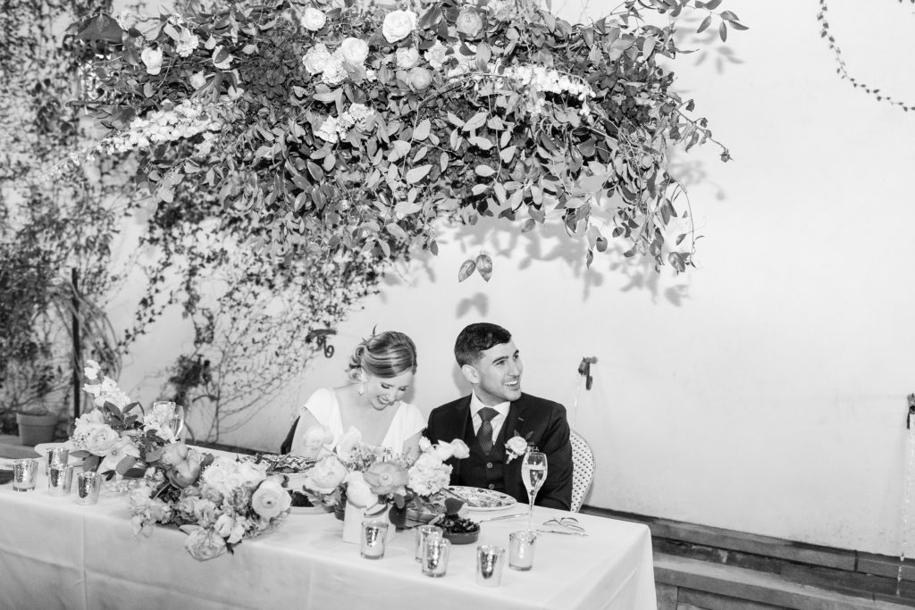 bride and groom at sweetheart table during spring wedding at Hotel Figueroa