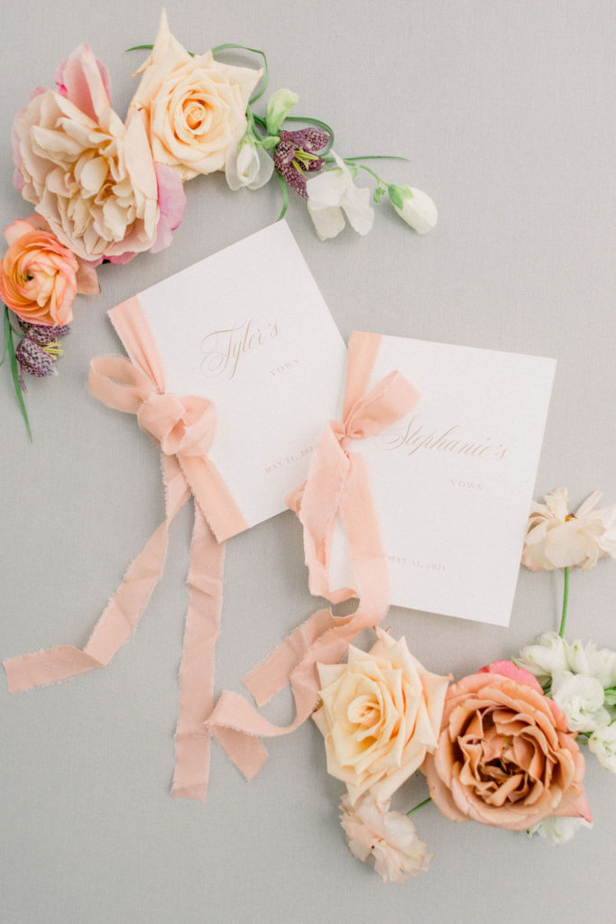 vow books with peach ribbon