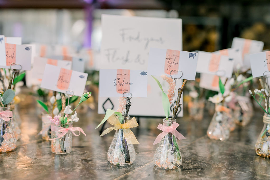beaker themed place cards for wedding escort board